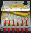 The fibre-ptic DIN mount rail distribution box. The coloured pigtails for loose-tube cables are clearly visible